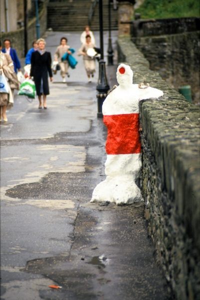In Their Place (1986) City walls, Derry. Nine life size figures. Re-inforced concrete, paint, reflectors, metal rings. Resting shopping figure. East wall