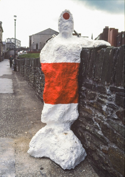 In Their Place (1986) City walls, Derry. Nine life size figures. Re-inforced concrete, paint, reflectors, metal rings. Resting shopping figure. East wall