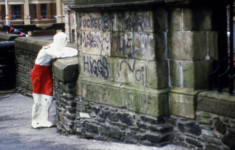 In Their Place (1986) City walls, Derry. Nine life size figures. Re-inforced concrete, paint, reflectors, metal rings. Guildhall square figure.&nbsp;&lsquo;&hellip;This work was situated in an art practice which evolved through lived experience of the 1970&rsquo;s Derry , art college in Belfast/Manchester in the late 1970s/80s and the artists&rsquo;s commitment to return to Derry in the mid-80s, specifically for this proposal for a series of nine poured concrete sculptures, sited on the Derry Walls, of human figures cast from life - friends and acquaintances posed and anonymised by the artist. The artist defined In their Place as &ldquo;political&nbsp; and politically metaphorical in the interests of producing new knowledge&nbsp; and renewed awareness of oppression&rdquo; &hellip;The politics of the work was determined in its materials - the concrete of the bollards used in checkpoints in the militarised city - and in the responses it received in the locality, including the &ldquo;active mutilating&rdquo; of one beheaded sculpture, and the alleged army bombing of another&rsquo; (text extract, Four decades of Irish Sculpture, In their Place (1987) Locky Morris, Declan Sheehan, Visual Artists' News Sheet, Special Issue (2020) &nbsp;