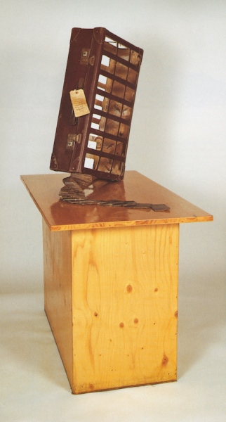 Twist (1989) 1300 x 560 x 980 mm. Suitcase, wood, bolts, lock, varnish, ink. Collection Belfast Media Group &nbsp; &nbsp;&nbsp;