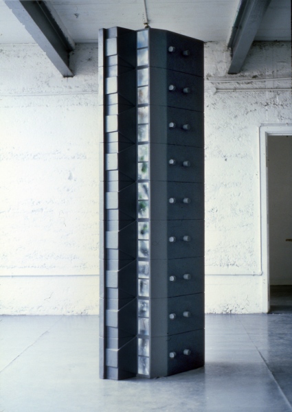 File (1988) 244 x 78 x 42 cm. Wood, paint. &lsquo;&hellip;Morris, too, has considered the way a systems approach is taken in army intelligence work. Works such as File and Woman of Interest are about the depersonalisation of individuals, despite building up a factual databank on them, and the distorted profile that might follow&hellip;&rsquo;&nbsp; (text extract, The City as Art, Liam Kelly, A.I.C.A , Irish section, 1994)