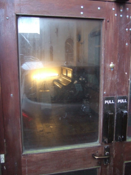 This Building (detail - &nbsp;framed photograph) (2010) variable dimensions (approx 50 x 150 x 145 cm) Upright piano elements, LP, framed photograph, powered speakers, CDR (looped audio)