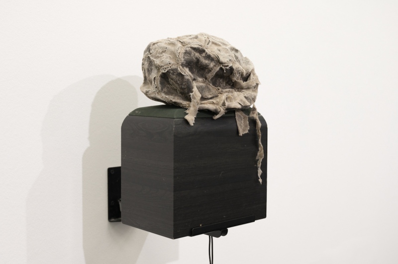 Up to a hundred (2000) 400 x 230 x 300mm. Found object (football) hi-fi speaker, speaker bracket, audio (16 min loop)&nbsp; &lsquo;...in the changed political climate of the past few years its hardly surprising that the combative critique of &lsquo;normalisation&rsquo; in Morris&rsquo;s work should give way to the more light-hearted theatricalisation of &lsquo;normality&rsquo; evident in the three pieces (all of 2000) which made up the &lsquo;The Work Of a Dog&rsquo;...&rsquo; The&nbsp; third work in the show, Up to a Hundred, was a busted football perched on a speaker which relayed an 16-min audio loop of the artist struggling to keep the ball in the air. The sad but familiar tale of unrealised adolescent dreams and thwarted prowess takes on particularly poignant undertones in a community in which many teenagers of Morris&rsquo;s generation felt compelled to &lsquo;put away such childish things&rsquo; at an unconscionably early age in order to take up arms...&rsquo;&nbsp;( text extract from Small Steps,&nbsp;Caoimhin Mac Giolla Leith,&nbsp;&nbsp;Catalogue 2001) &nbsp;&nbsp;