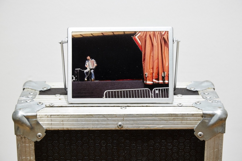 Opening Act (2016) 980 x 180 x 460mm.&nbsp; C-type print, artists&rsquo; keyboard flight case, readymade frame&nbsp; '...Dissolving boundaries between convention and experimentation extends to titles and captions that with rhetorical flourish draw further meaning. Opening Act (2016), a photograph in a readymade frame resting on top of a keyboard flight case suggests the beginning and end of performance narrative continually on the move;...' (text extract from&nbsp;Especiallyeverything: the practices of Locky Morris,&nbsp;Anne Tallentire, Once a day every day all day long, Locky Morris 2019)